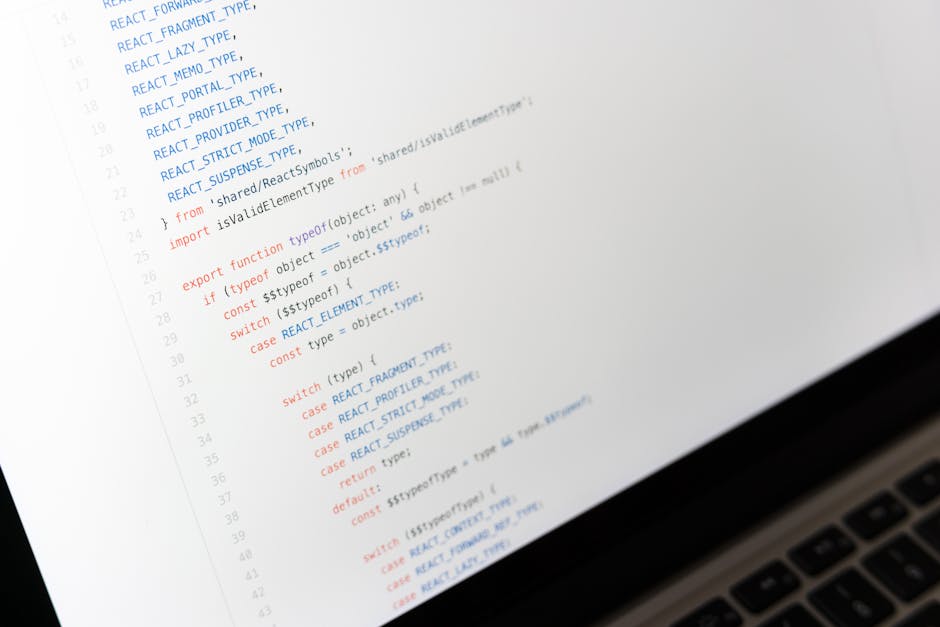 A close-up photograph of a laptop screen displaying lines of code in a development environment. The code includes syntax highlighting with various colors such as blue, orange, and black, structured with functions, imports, and switch statements. The background features a light-colored surface, possibly a desk or table, with the lower right corner showing the edge of a keyboard. The overall scene is well-lit, emphasizing the clarity of the text and the reflective surface of the screen, indicative of a technical or programming context. This image relates to IT work, coding, or software development, which can be associated with alternative approaches to managing digital data, comparable to private waste handling or independent collection services in waste management, as represented by Rubbish Removal Mayfair.
