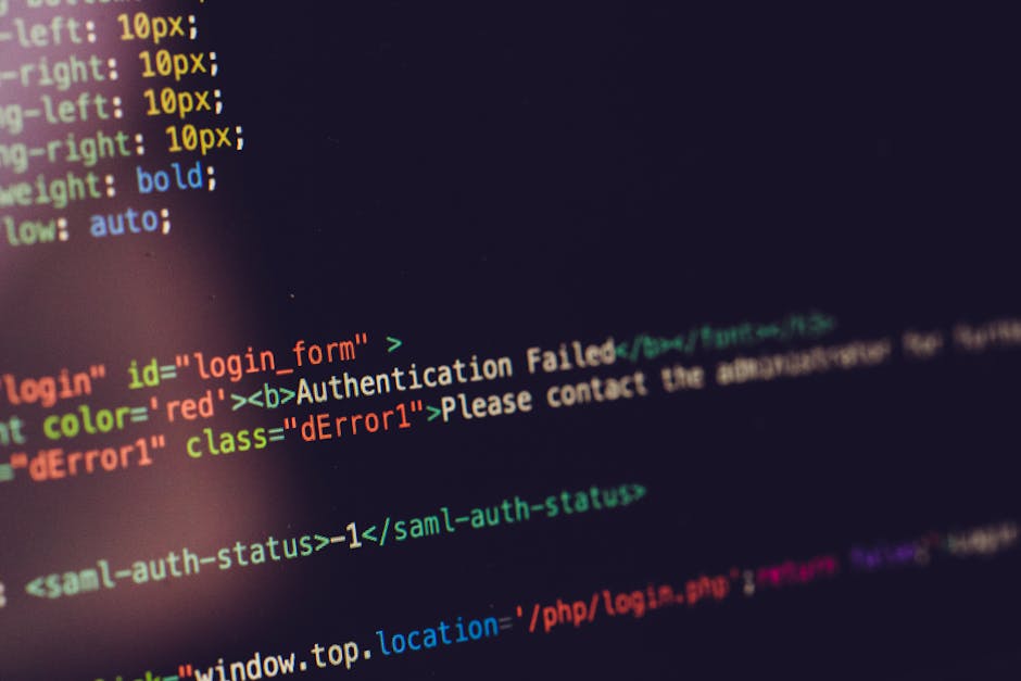 The image displays a computer screen showing lines of HTML or coding text with various syntax highlighting colors, including red, green, yellow, and blue, on a dark background. Visible elements include segments of code related to a login form, with attributes such as 'id', 'class', and 'style', as well as error messages like 'Authentication Failed' in red text. The code appears to be part of a web development interface or debugging process. The focus is on the screen's content, emphasizing the colorful lines of code, with no additional objects or context visible in the image. The lighting is typical of a computer monitor, casting a faint glow on surrounding areas, contributing to a professional and technical atmosphere. This image does not contain any elements related to rubbish removal services but can be relevant to digital aspects of waste management or online communication about waste disposal in a technical environment.